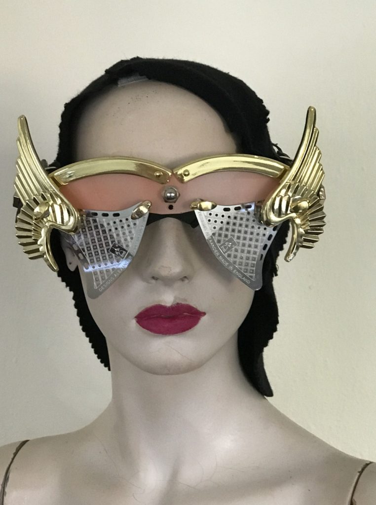 artistic modern steampunk eye wear mask metal wings perforated metal ocular lens Hi Tek pink face