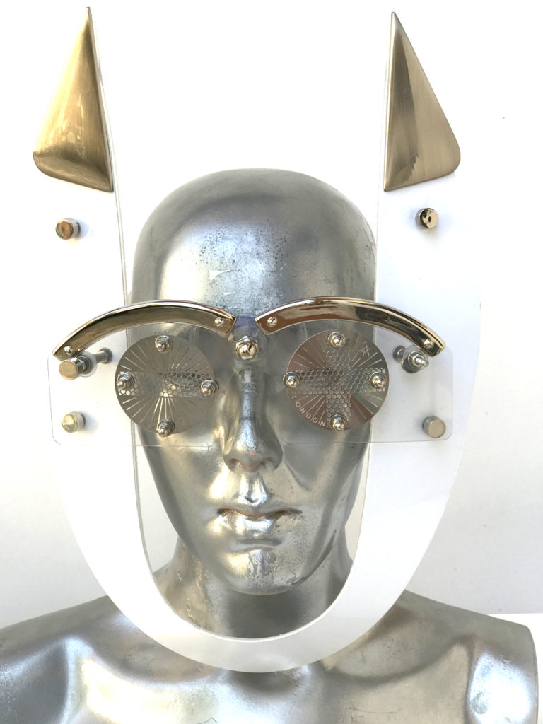white mask with horns perforated metal ocular lens metal components, styling video, Burning Man
