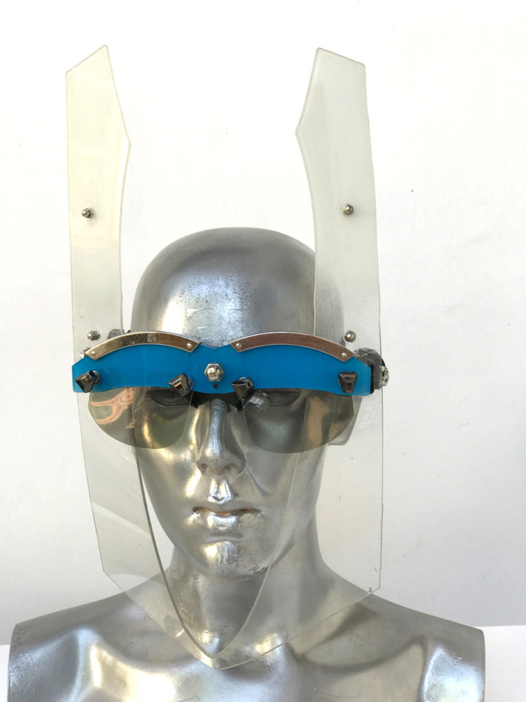 blue and white eye wear mask with horns and metal components, styling video, Burning Man
