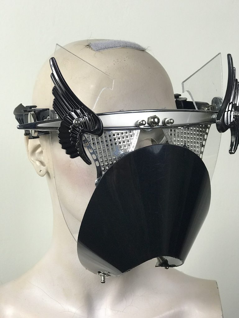 Metal mask with wings perforated metal ocular lenses and muzzle