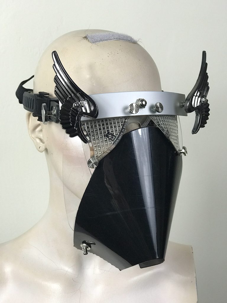 Metal mask with wings perforated metal ocular lenses and muzzle